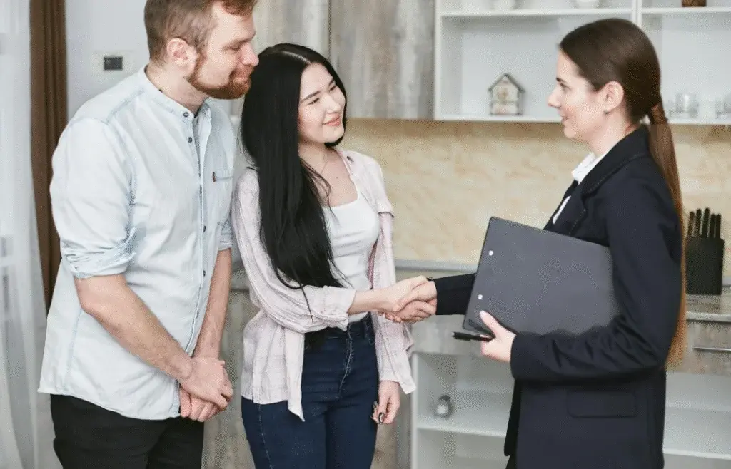 Authorise someone to sell my car UK – a couple meeting with a professional agent to handle car selling process legally and smoothly.