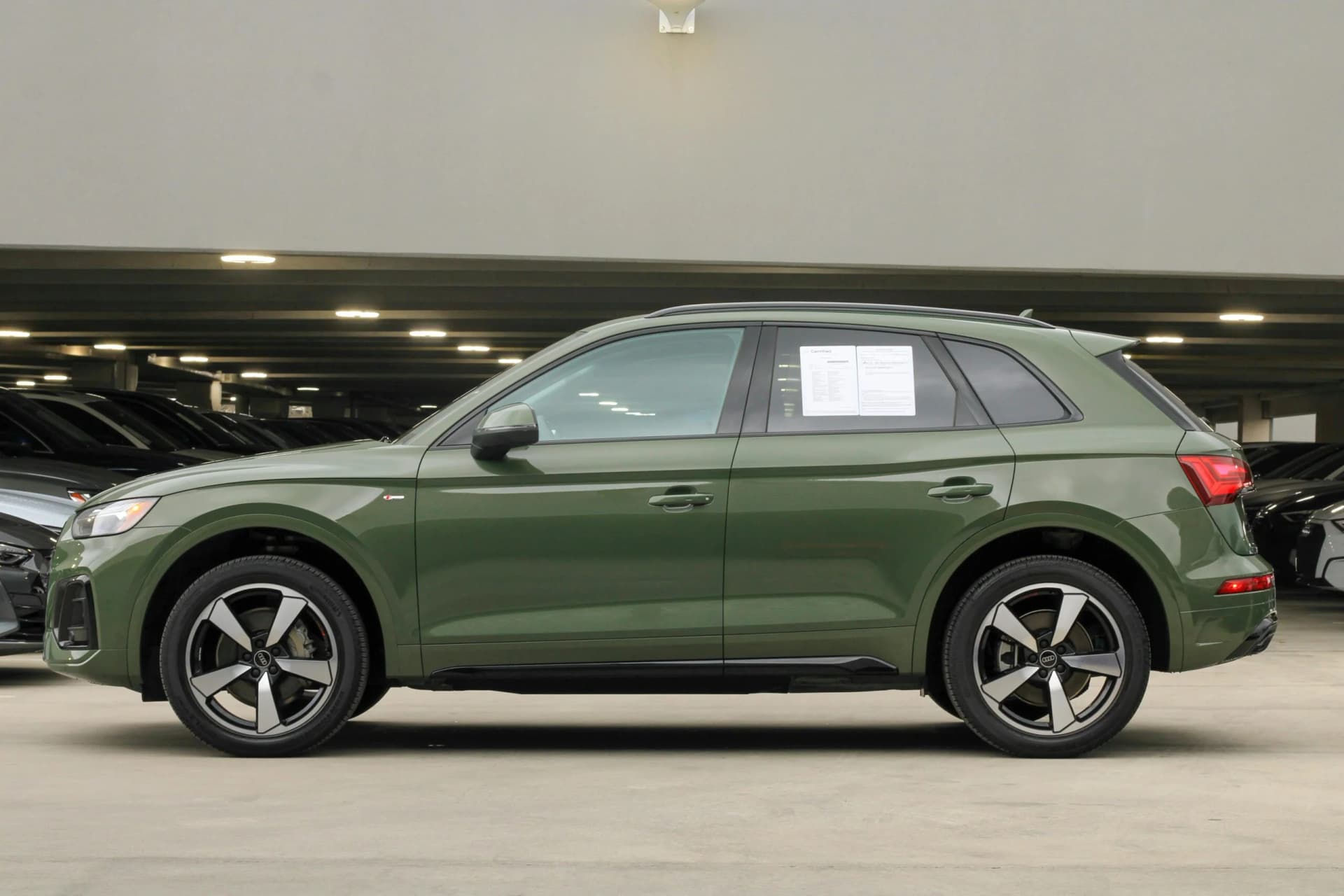 Sell my leased car – a green modern SUV parked in a dealership ready for resale or lease return process.